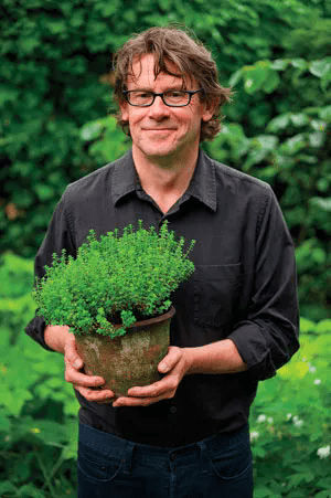 Nigel Slater holding a pot of plant